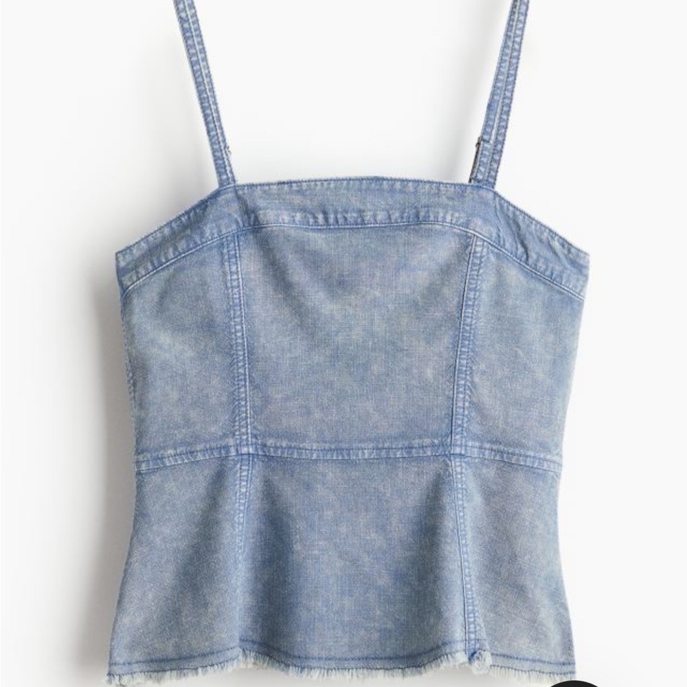 BRAND NEW WITH TAGS. Denim top with peplum detailing.
